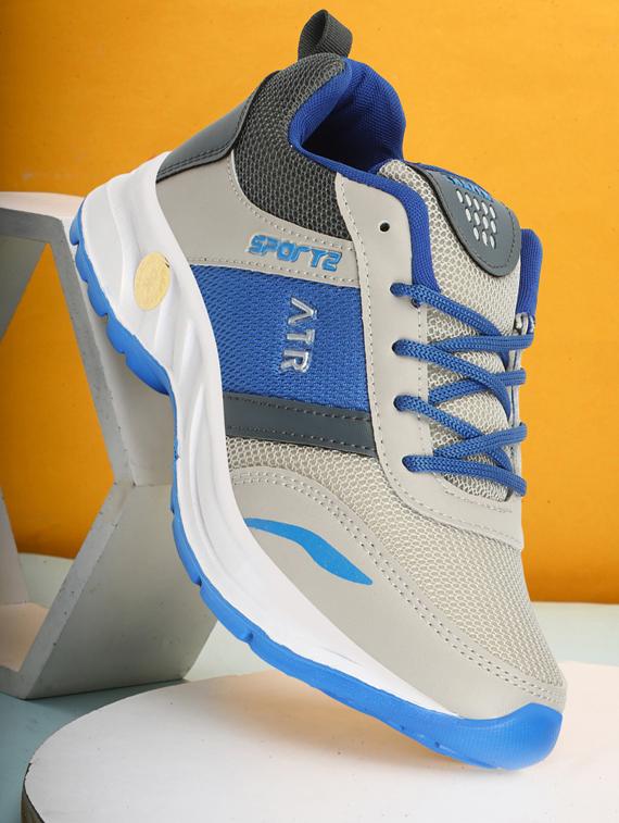 men lace up sports shoes