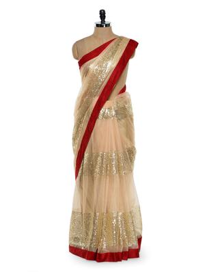 Gorgeous cream sequined saree with red border
