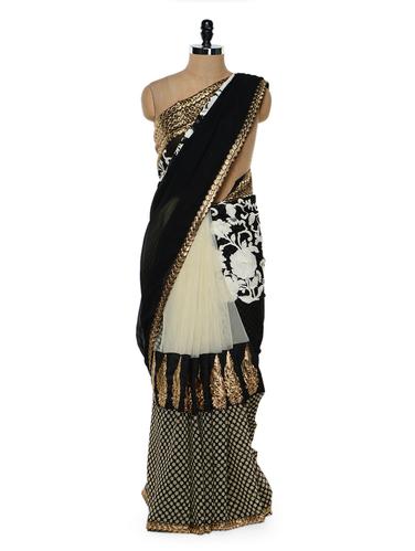 Black and white saree with gold border