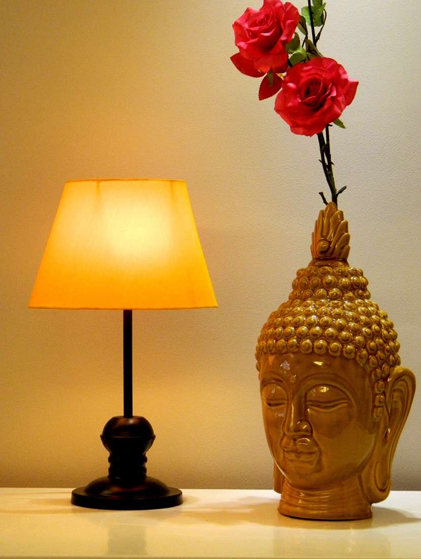 yellow metal and fabric table lamp