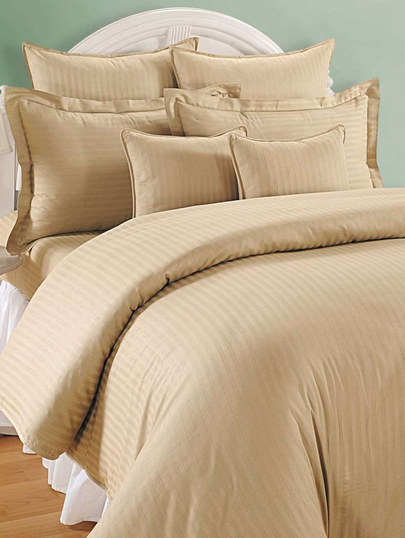 beige self striped bed sheet with pillow covers