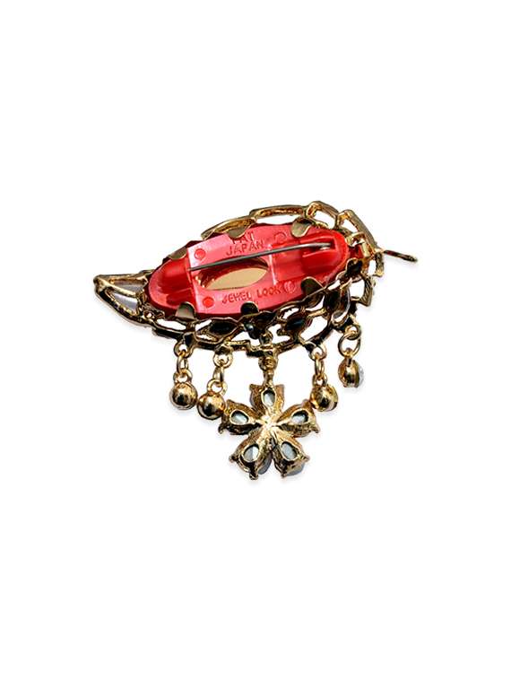 pink metal brooch - 13328155 -  Standard Image - 1