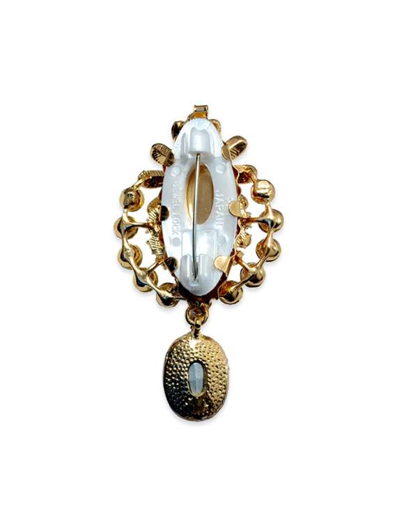 blue metal brooch - 13328185 -  Standard Image - 1