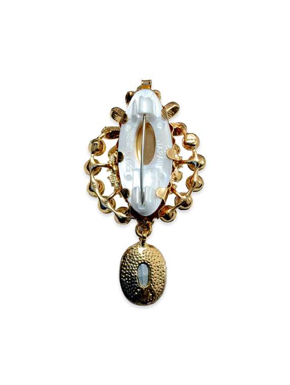 beige metal brooch - 13328187 -  Standard Image - 1