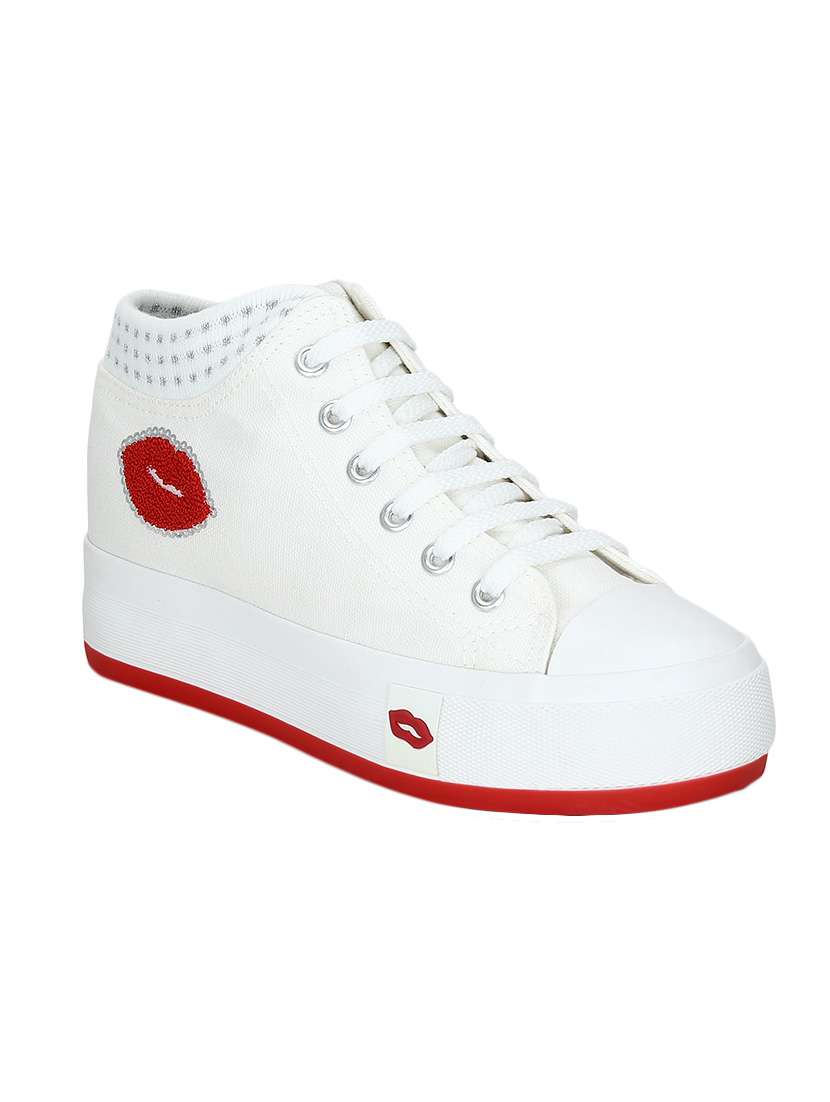 white canvas plimsolls sneakers