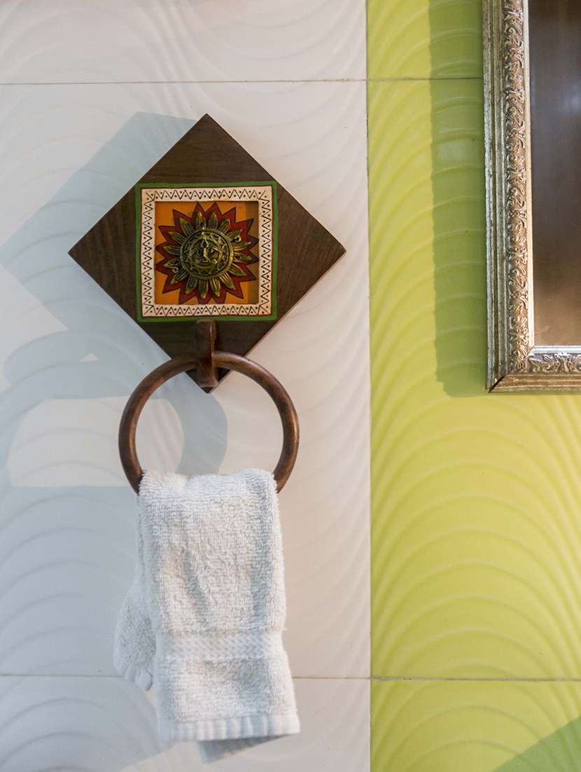 brass & wood warli hand-painted sun adorned dhokra towel holder in sheesham wood