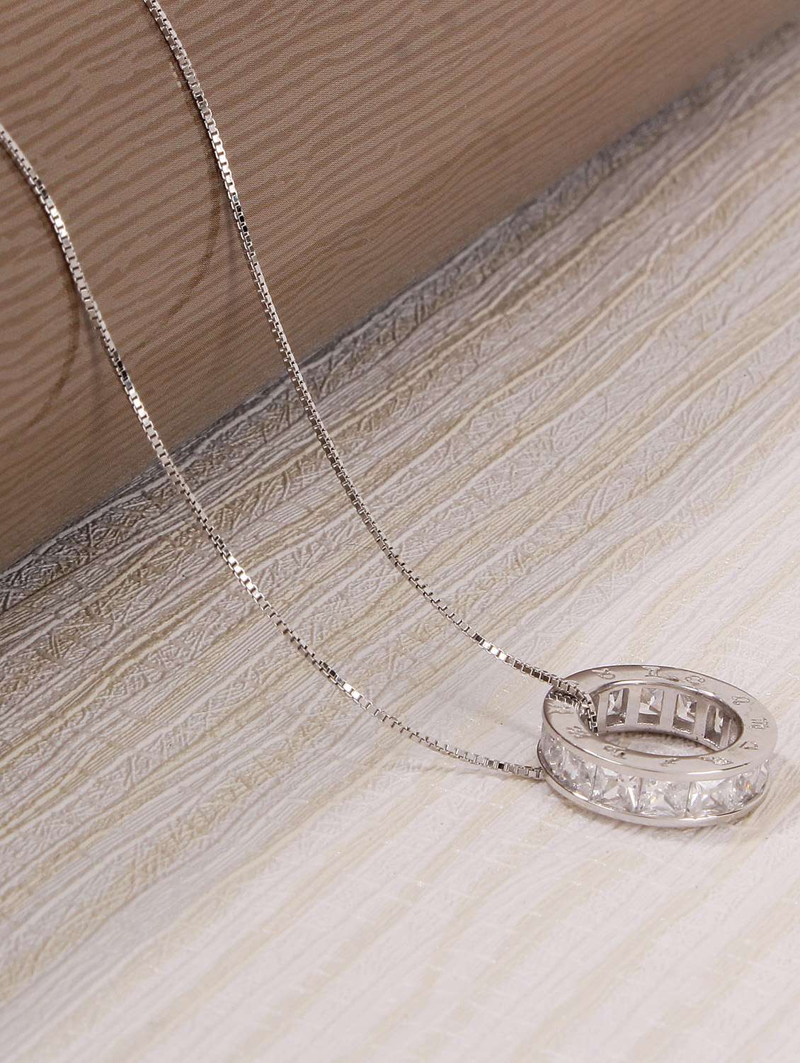 silver metal pendant