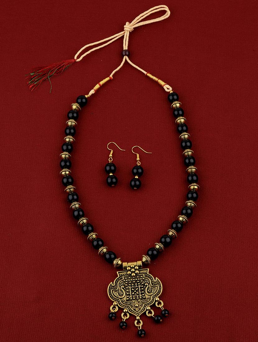 gold metal necklaces and earring - 16931837 - Standard Image - 1