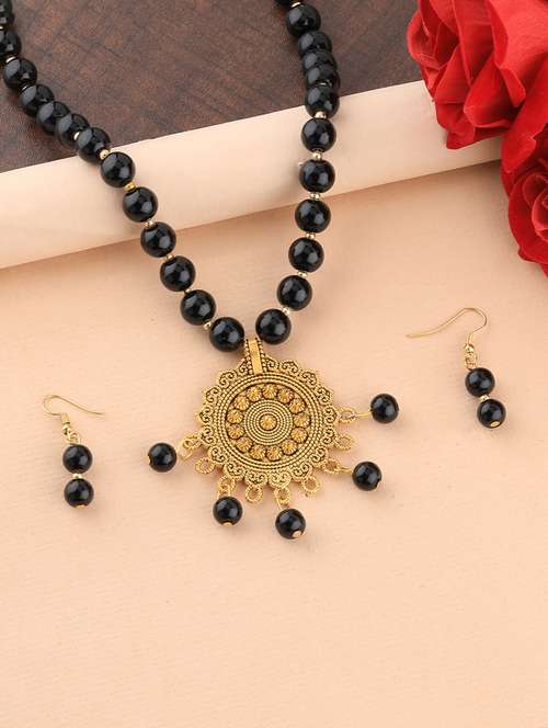 gold metal pendants and earring - 16931853 - Standard Image - 0