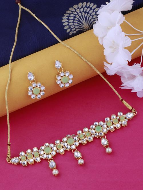 green metal choker and earring - 17527507 -  Standard Image - 0
