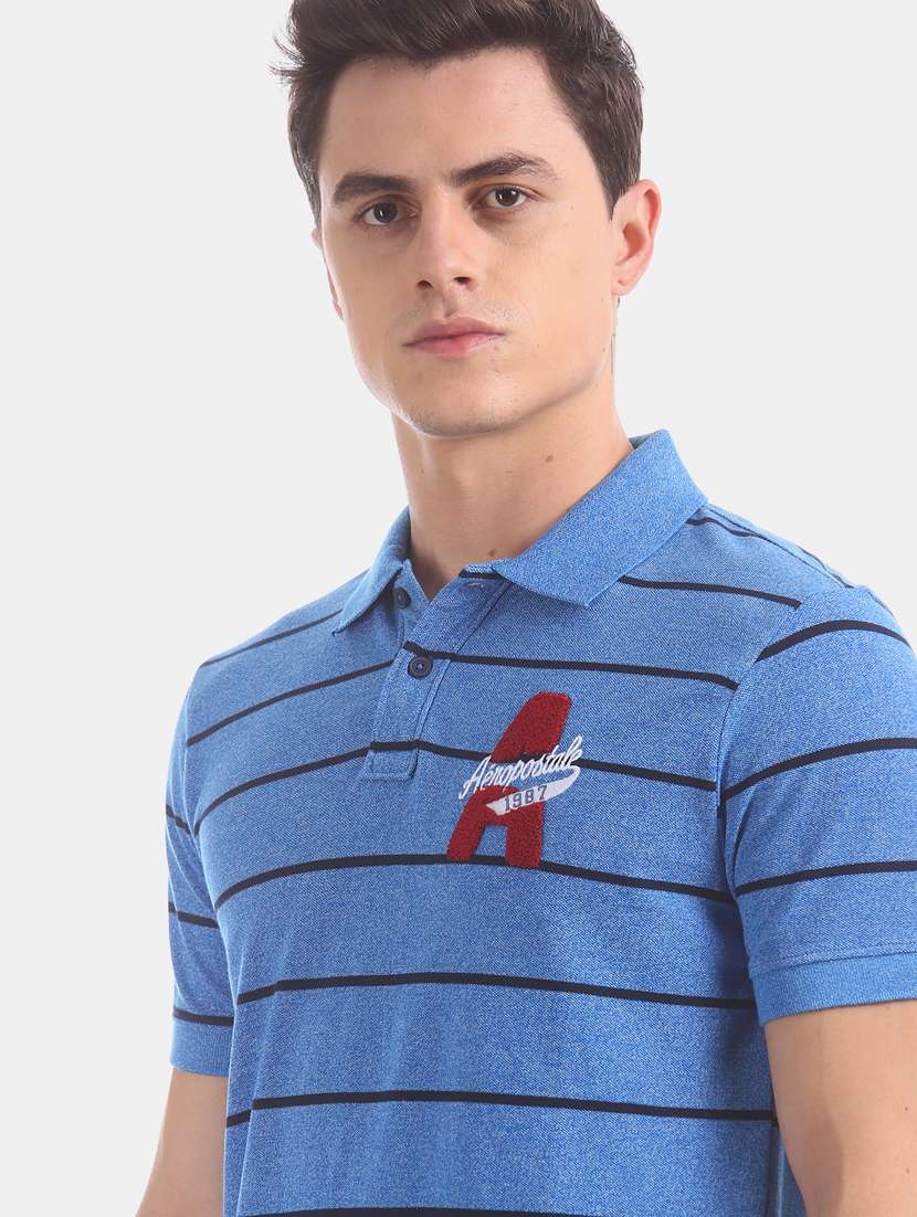 blue striped polo t-shirt  - 17625729 -  Standard Image - 4