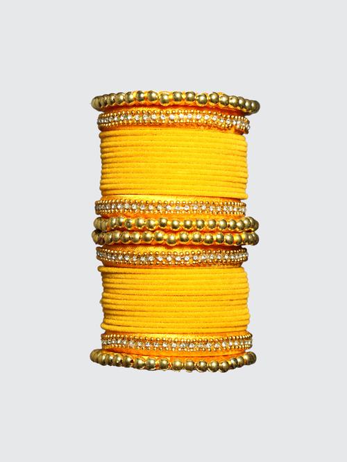 handmade silk thread yellow bangles set of 32 - 18031753 -  Standard Image - 0