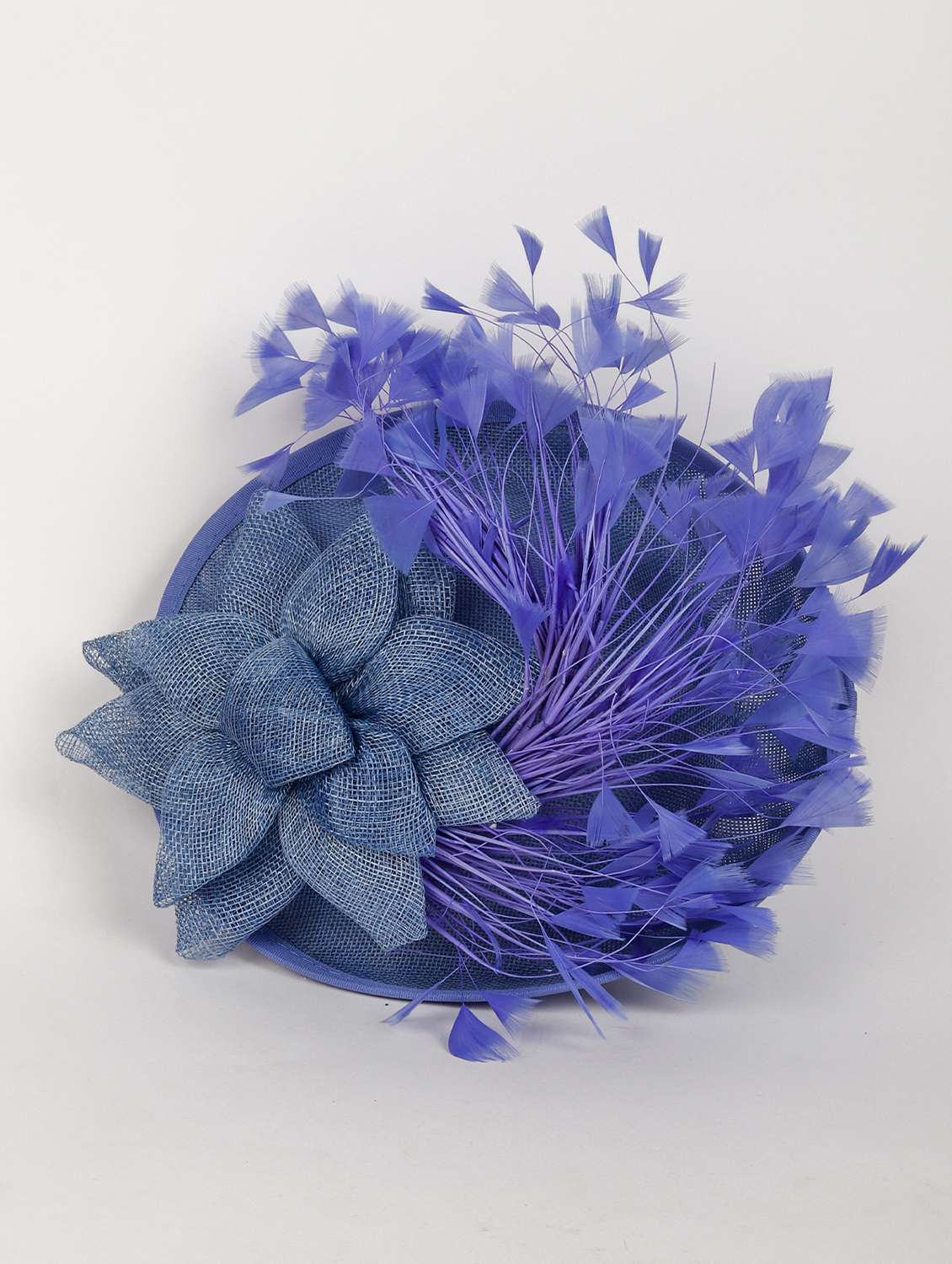  blue fascinator with a fluffy bouquet of flighty feathers.