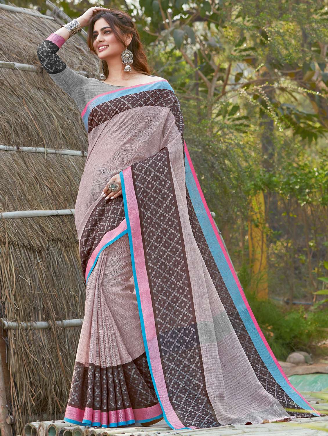 women's self design brown colored saree