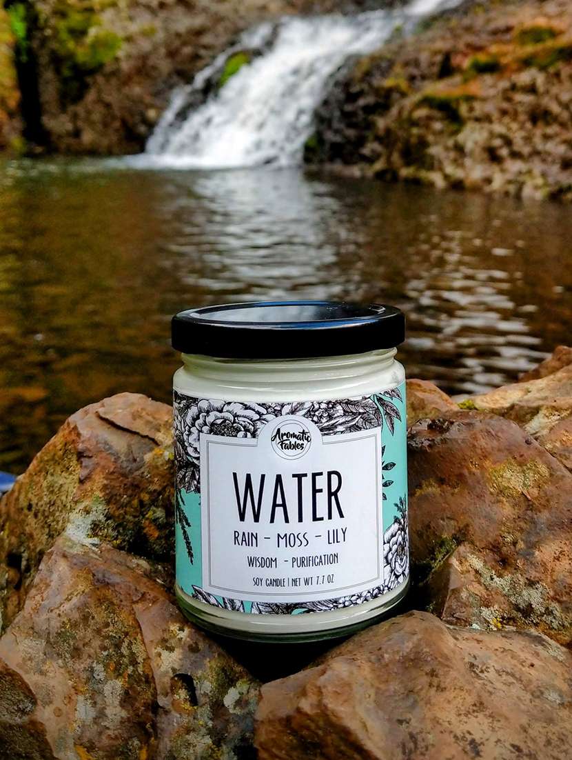 elements of earth water scented white color glass jar candle