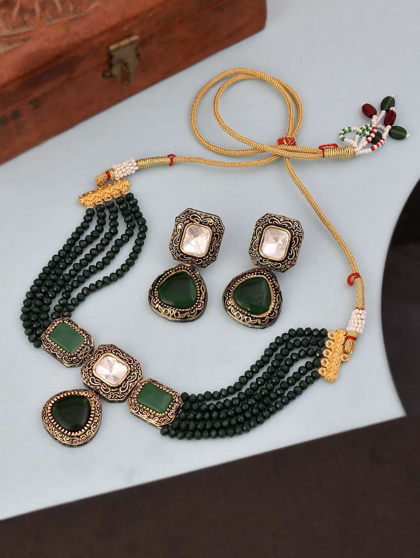 green brass necklaces and earring - 18387521 -  Standard Image - 1