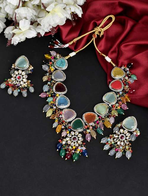 multi colored brass necklaces and earring - 18390667 -  Standard Image - 0