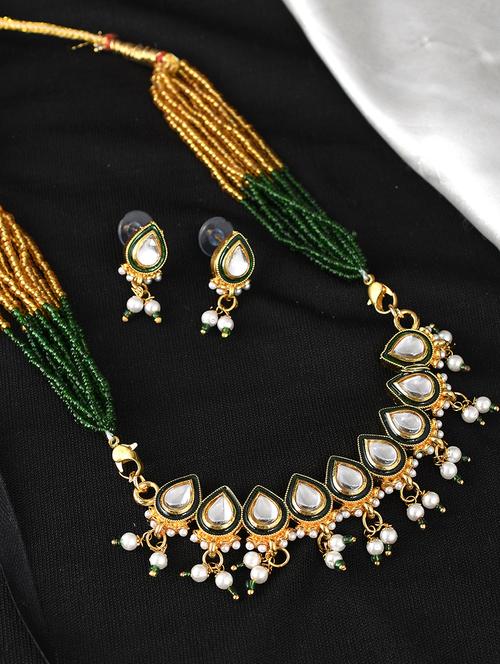 green brass necklaces and earring - 18399859 - Standard Image - 0