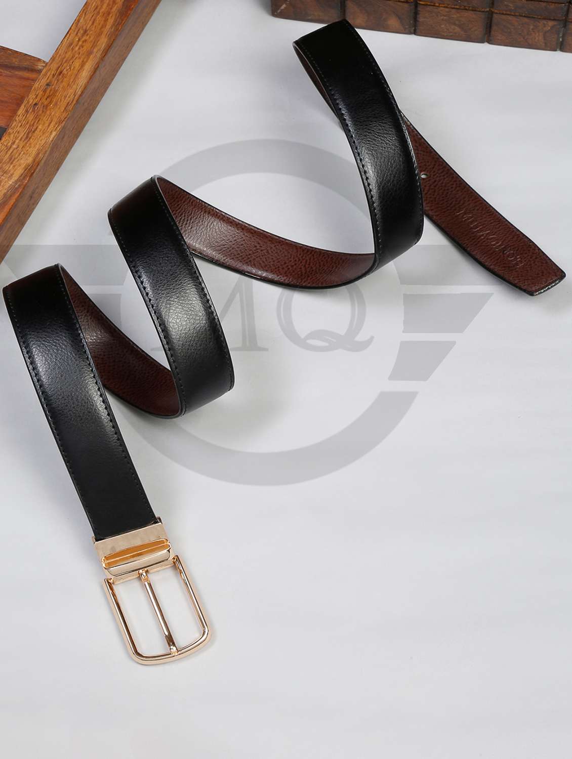 shrunk black leather belt