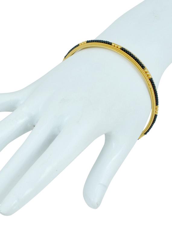 gold brass bangle - 18534738 -  Standard Image - 1