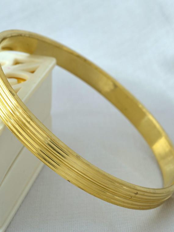gold plated bangle - 18534884 -  Standard Image - 1