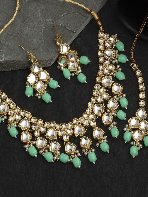 gold plated necklace with earrings  - 18567598 -  Standard Image - 0