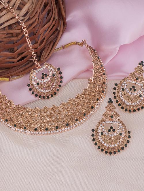 green stone studded gold plated necklace with earring and maang tikka  - 18567608 -  Standard Image - 0