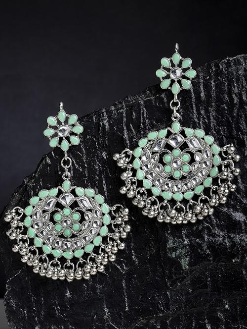 green metal earring - 18633276 -  Standard Image - 0