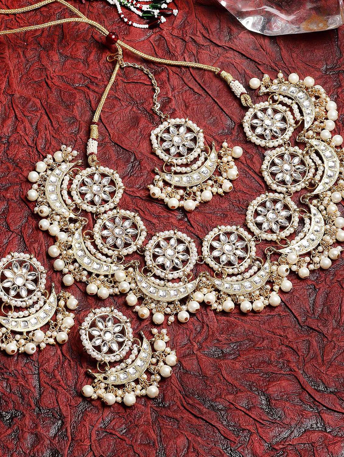 gold plated white plearl chand shape kundan necklace earrings and maang tikka set 