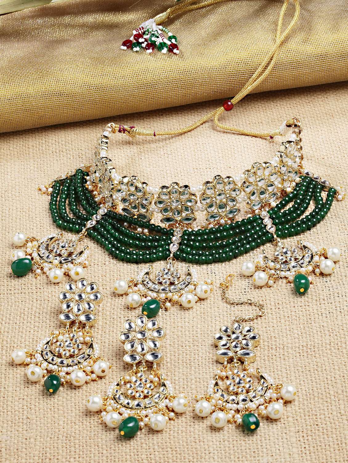 gold plated green beads multilayered kundan necklace earrings and maang tikka set 