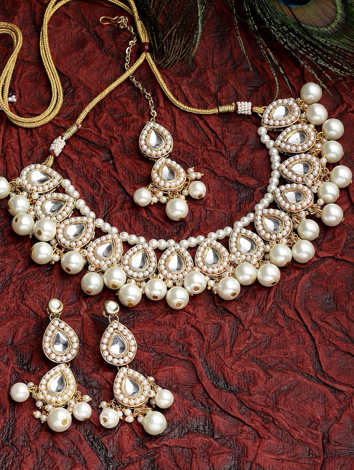 gold plated pearl and drop kundan necklace earrings and maang tikka set