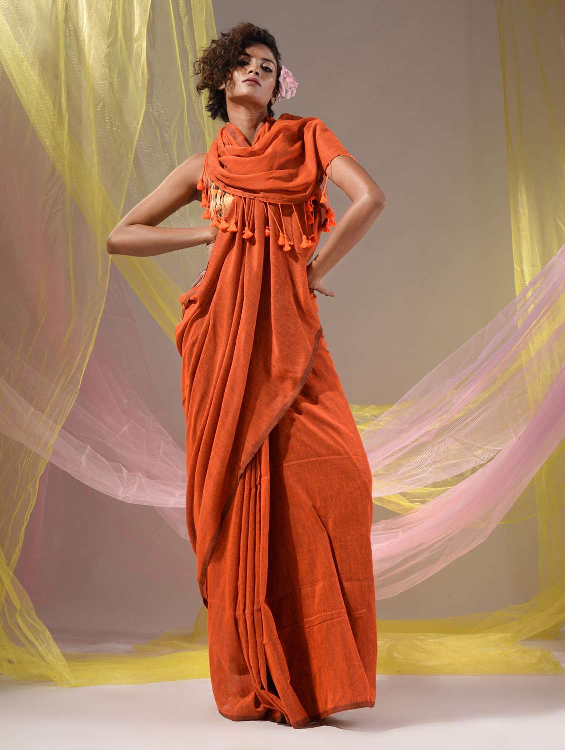 women's solid orange colored saree with blouse
