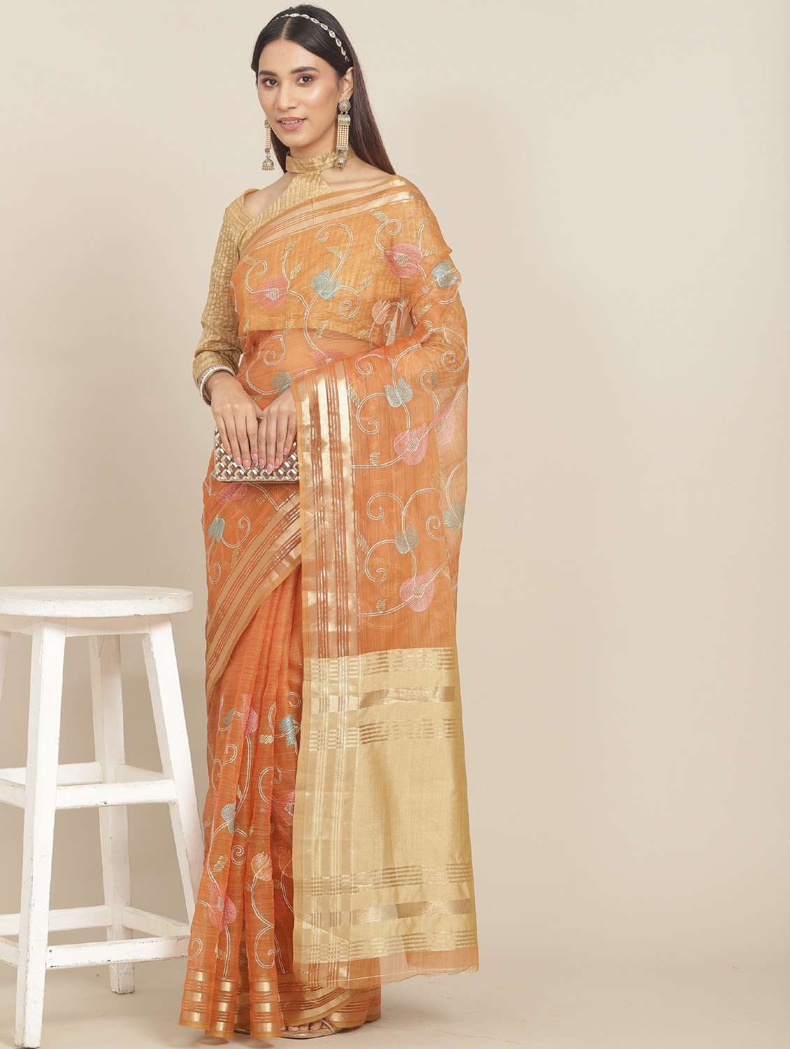 women's self design orange colored saree