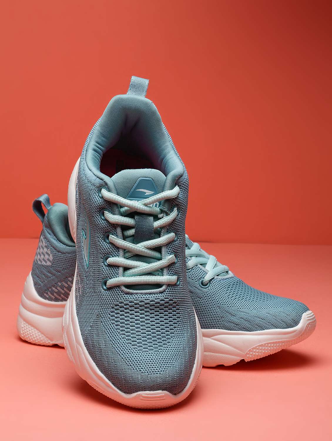 women lace up sport shoes