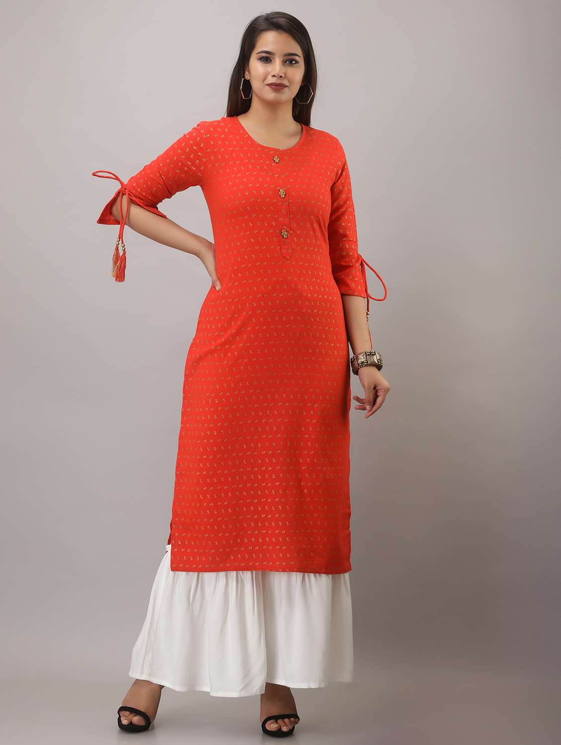 orange printed three quarter sleeve kurta sharara set