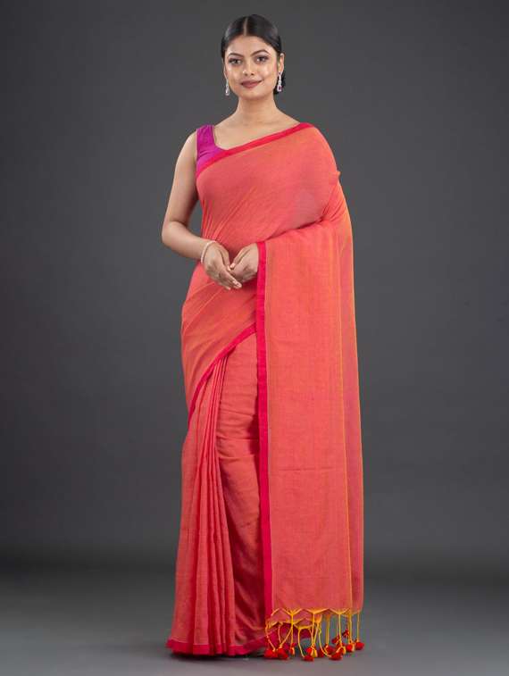 women's solid orange colored saree with blouse