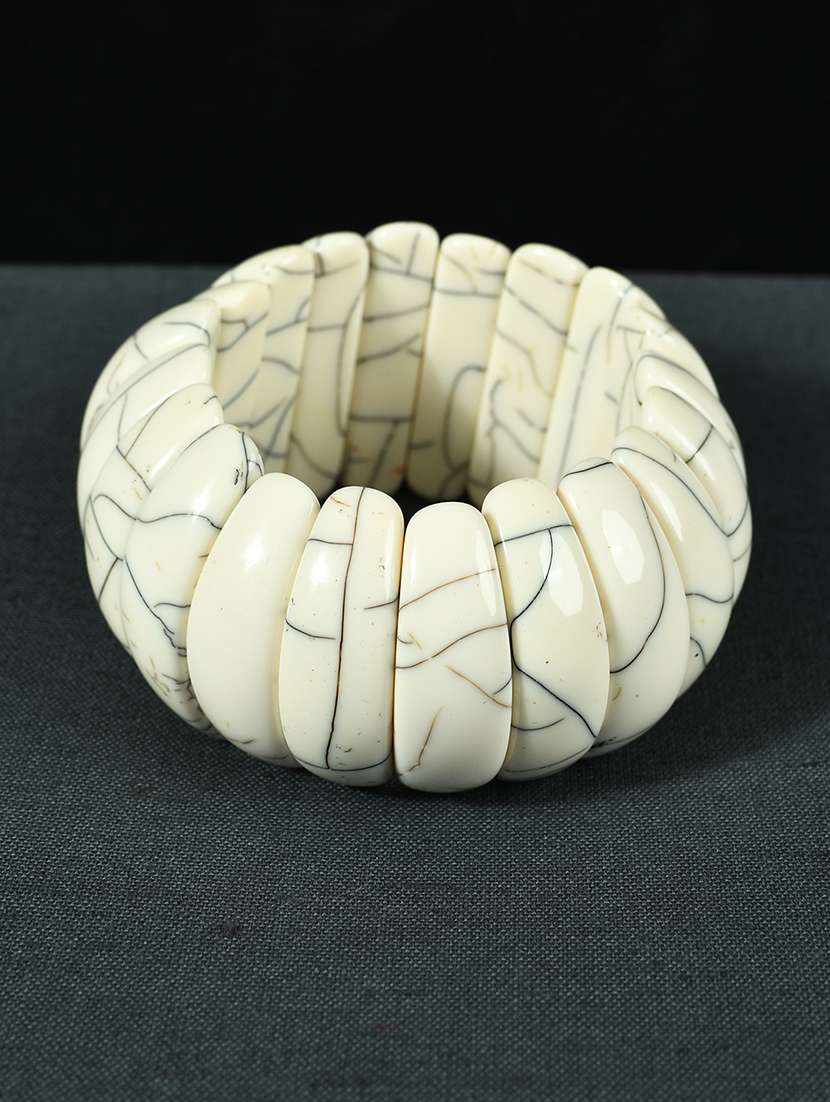 white plastic bangle bracelets