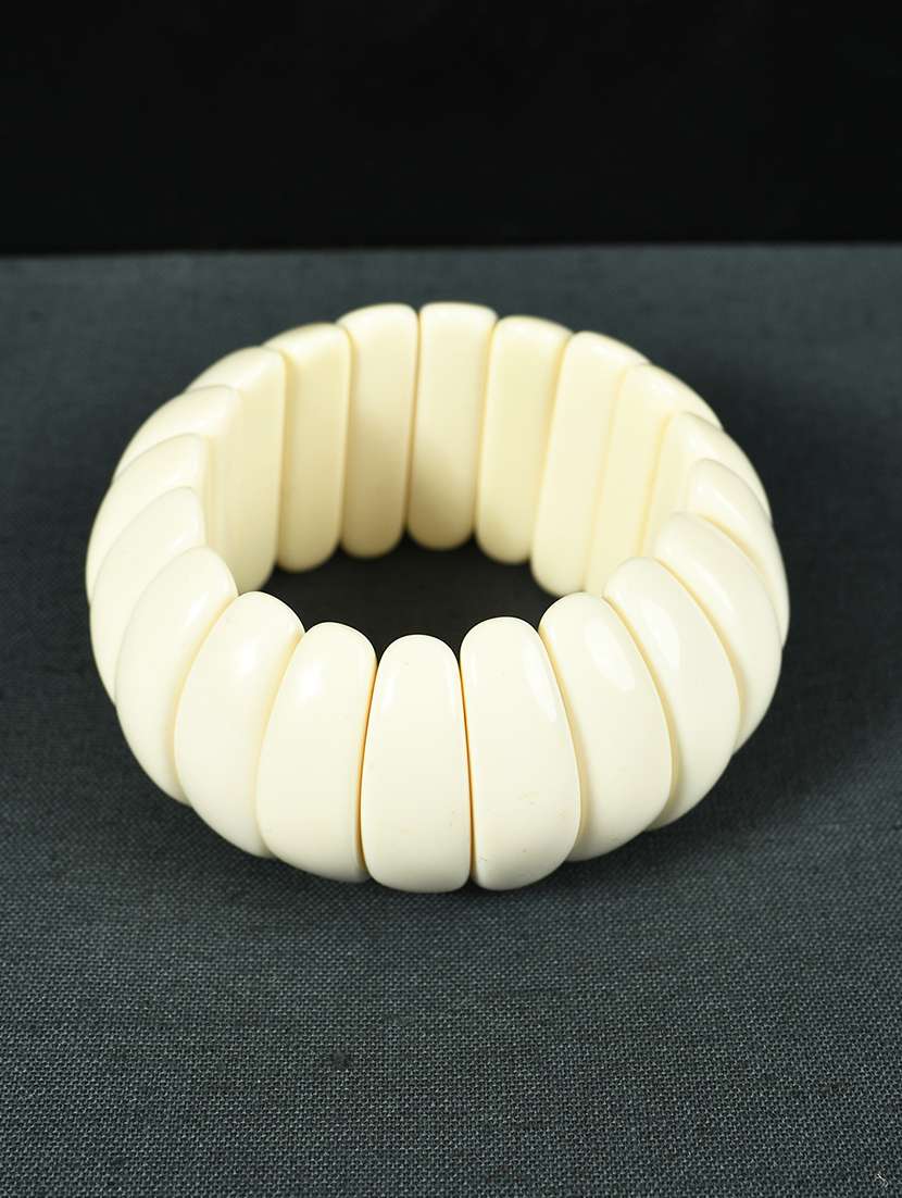 white plastic bangle bracelets