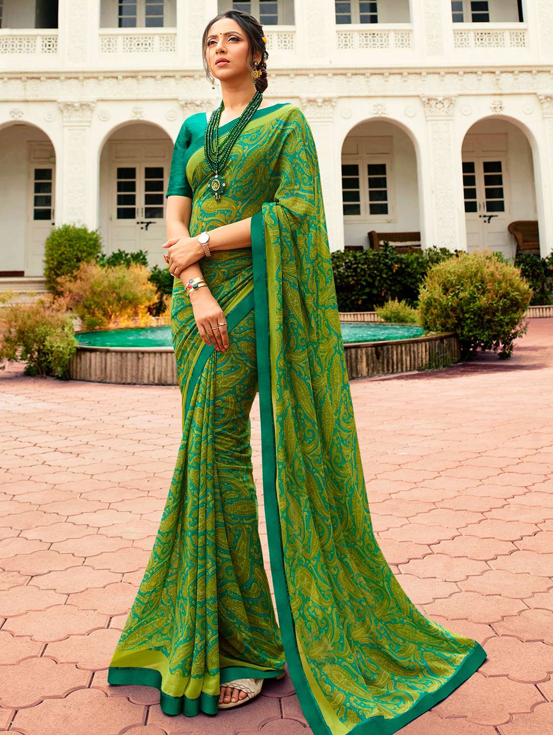 women's paisley green colored saree with blouse