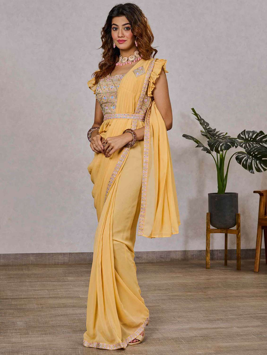 women yellow solid lace work saree with blouse