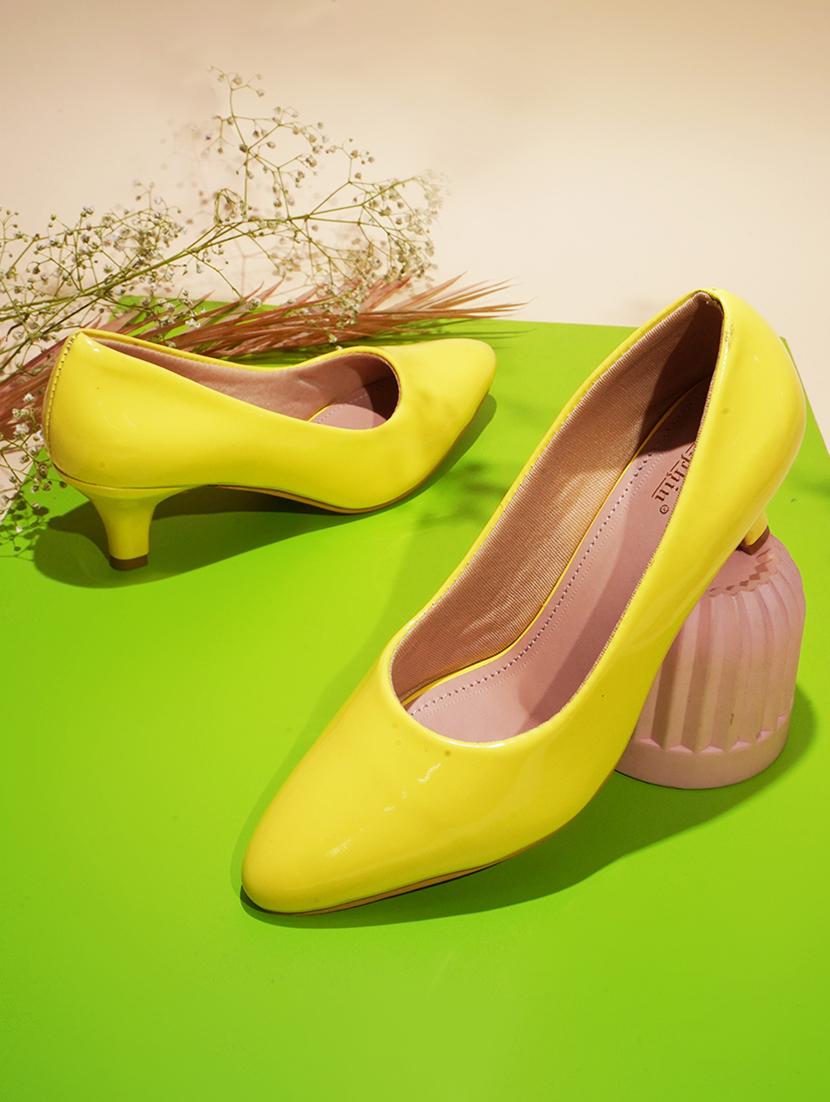 women yellow slip on kitten heel pump