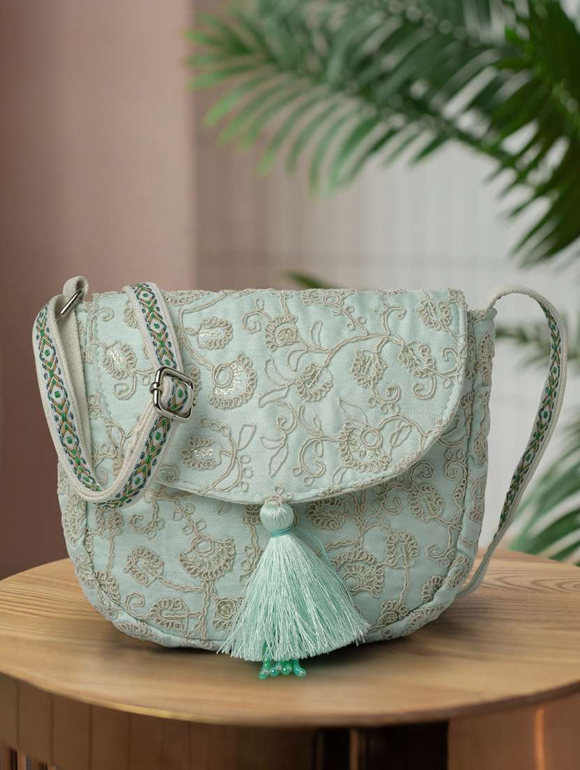 see green embroidered sling bag