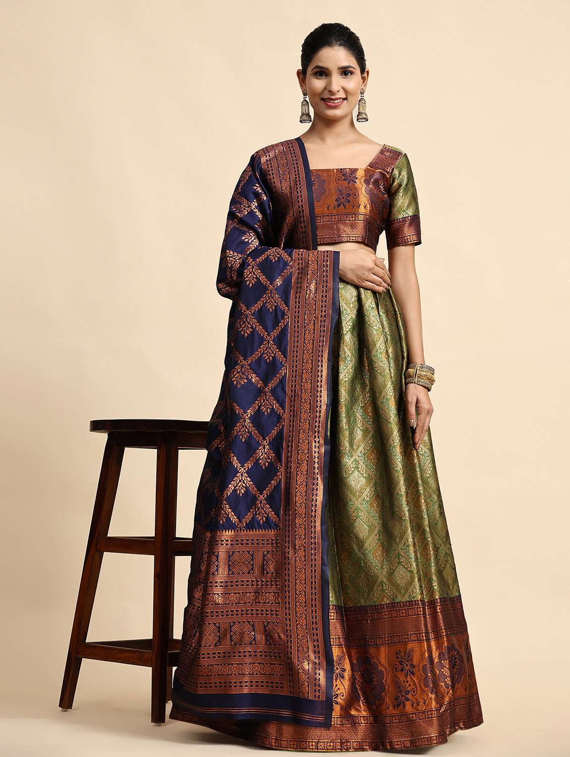 women green unstitched banarasi lehenga choli with dupatta