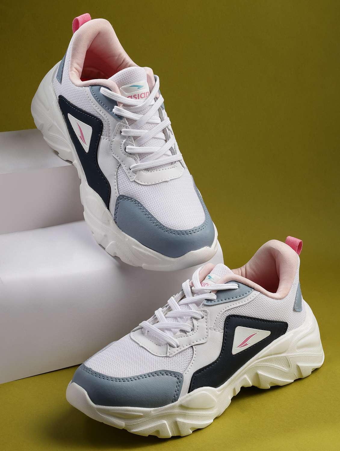 white lace-up sports shoes