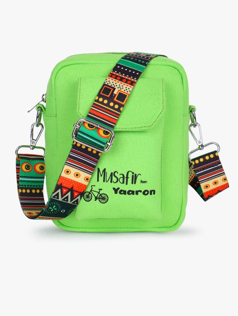 green canvas sling bag