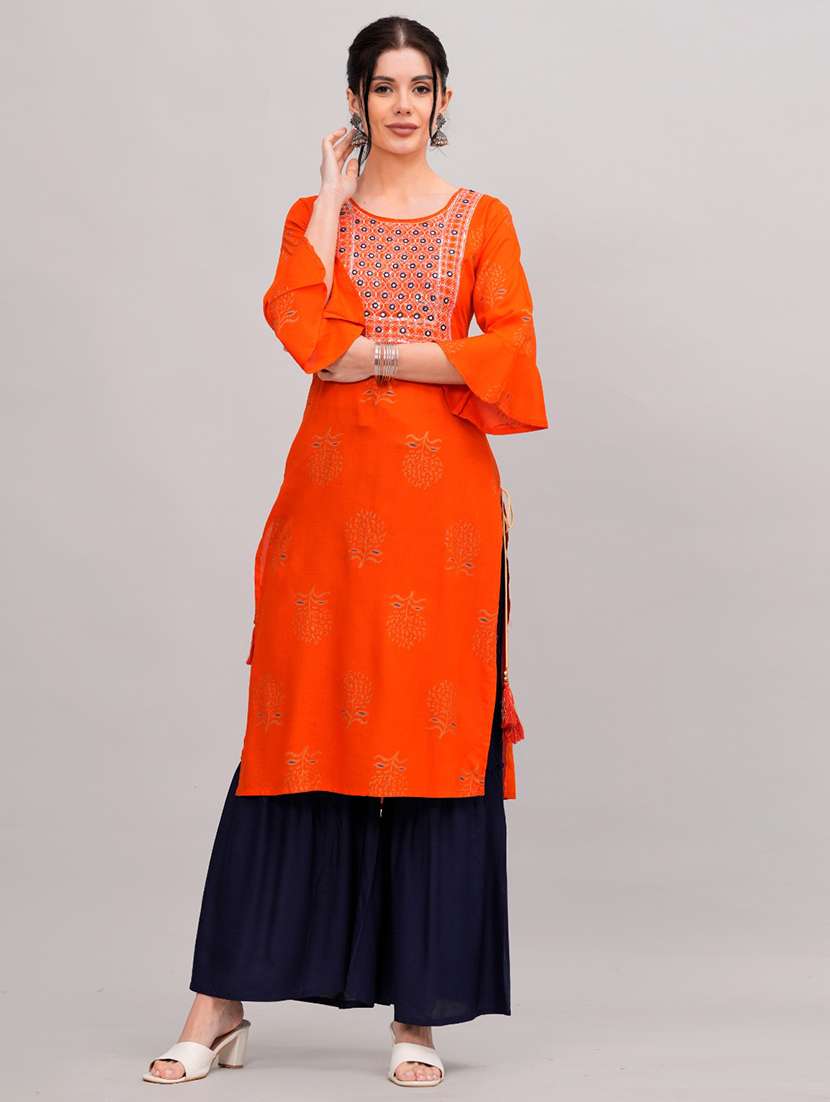 women orange kurta sharara set