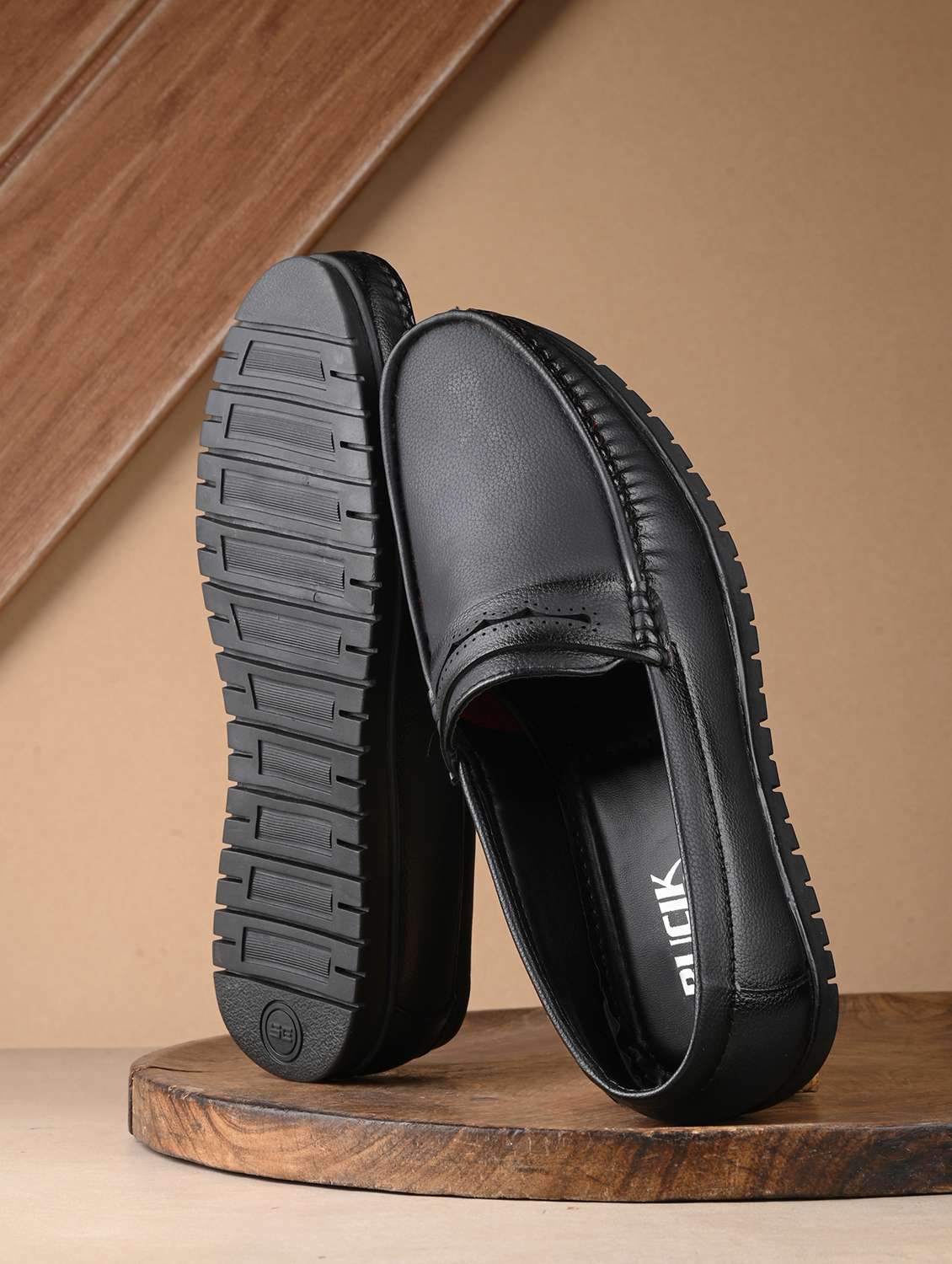 black synthetic slip on loafers