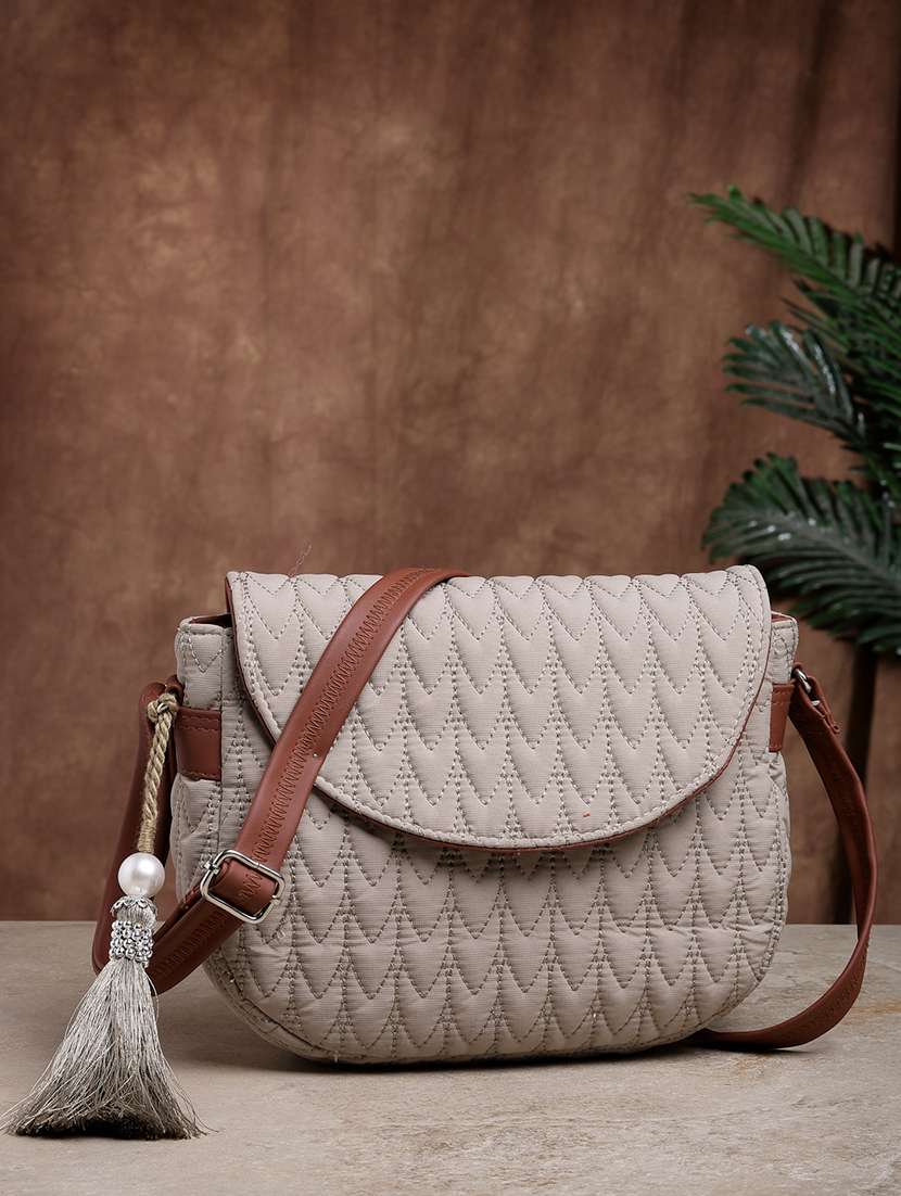 women textured sling bag