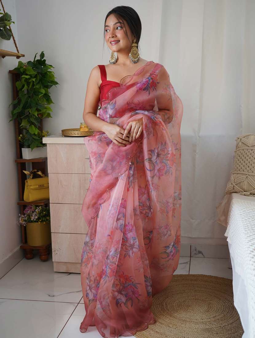 women peach floral printed saree