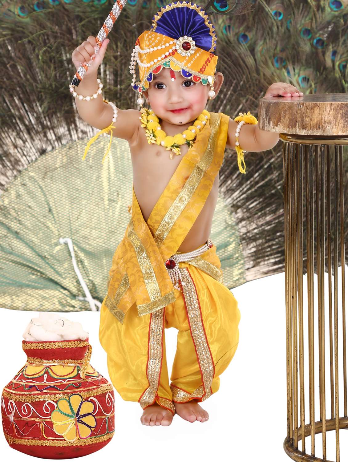 lord krishna costume complete with a peacock-feather mukut and a bansuri